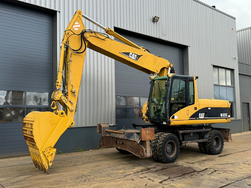 Caterpillar M322C - Hydraulic stabilizers / VA Triple boom / CE-certified, - Bager na kotačima: slika Caterpillar M322C - Hydraulic stabilizers / VA Triple boom / CE-certified, - Bager na kotačima Caterpillar M322C - Hydraulic stabilizers / VA Triple boom / CE-certified, - Bager na kotačima: slika Caterpillar M322C - Hydraulic stabilizers / VA Triple boom / CE-certified, - Bager na kotačima