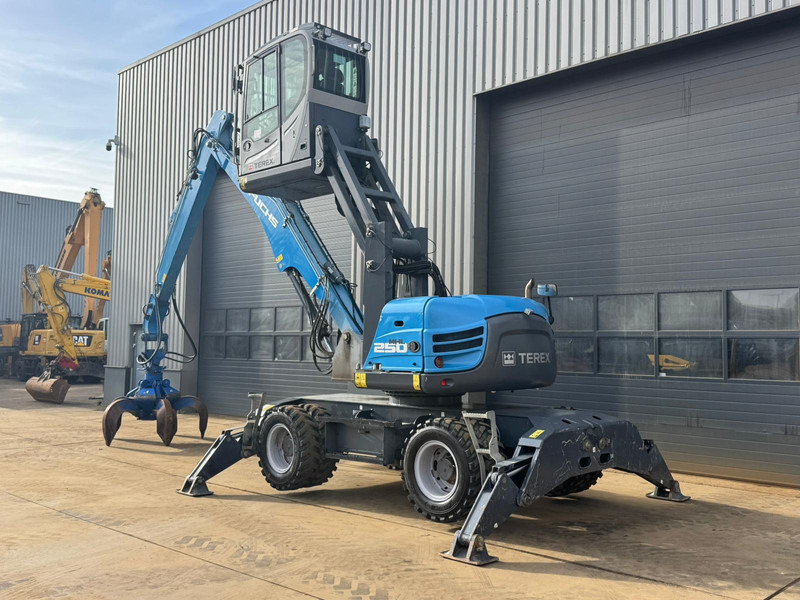 Fuchs MHL 250 - Stroj za rukovanje otpadom: slika Fuchs MHL 250 - Stroj za rukovanje otpadom Fuchs MHL 250 - Stroj za rukovanje otpadom: slika Fuchs MHL 250 - Stroj za rukovanje otpadom