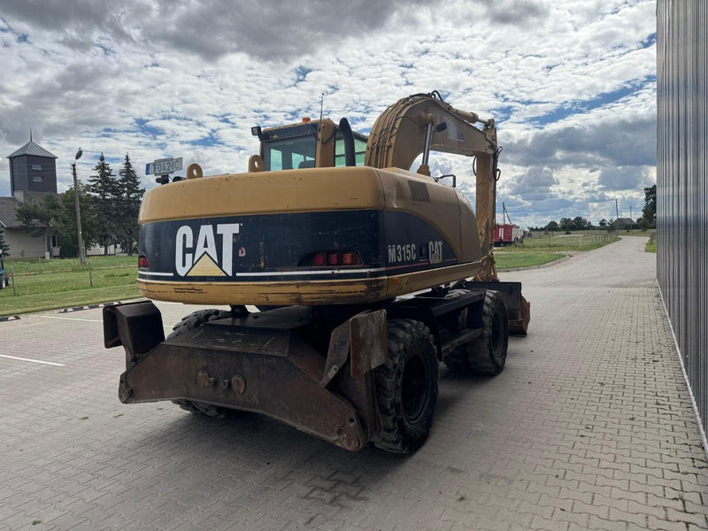 Caterpillar M 315 C - Bager na kotačima: slika Caterpillar M 315 C - Bager na kotačima Caterpillar M 315 C - Bager na kotačima: slika Caterpillar M 315 C - Bager na kotačima