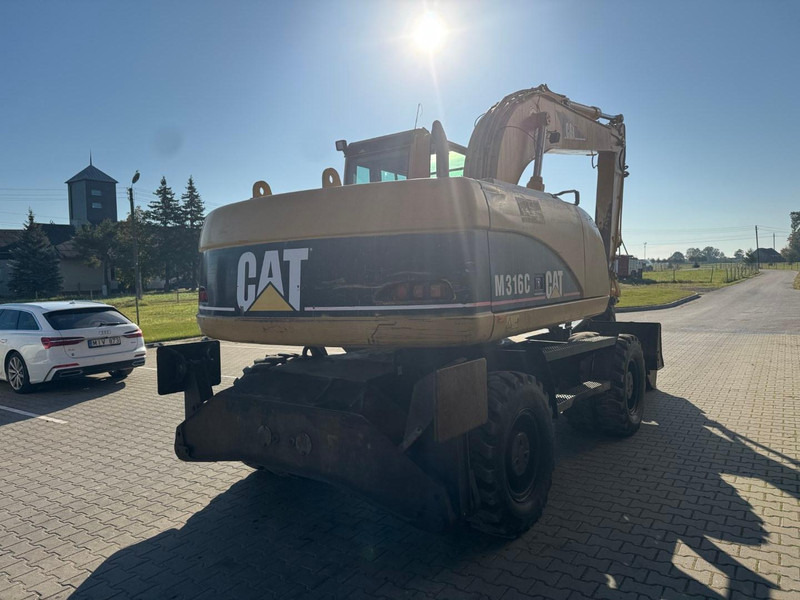 Caterpillar M 316 C - Bager na kotačima: slika Caterpillar M 316 C - Bager na kotačima Caterpillar M 316 C - Bager na kotačima: slika Caterpillar M 316 C - Bager na kotačima