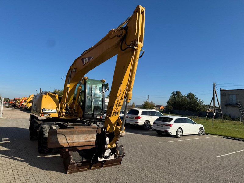 Caterpillar M 316 C - Bager na kotačima: slika Caterpillar M 316 C - Bager na kotačima Caterpillar M 316 C - Bager na kotačima: slika Caterpillar M 316 C - Bager na kotačima