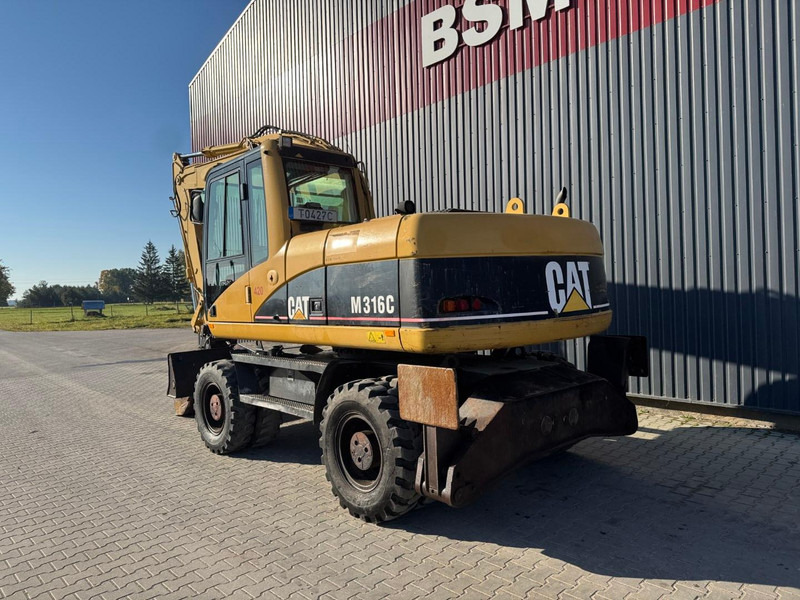 Caterpillar M 316 C - Bager na kotačima: slika Caterpillar M 316 C - Bager na kotačima Caterpillar M 316 C - Bager na kotačima: slika Caterpillar M 316 C - Bager na kotačima