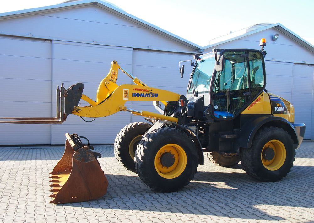 Ładowarka Komatsu WA100M 2007 Ładowarka Komatsu - Utovarivač na kotačima: slika Ładowarka Komatsu WA100M 2007 Ładowarka Komatsu - Utovarivač na kotačima Ładowarka Komatsu WA100M 2007 Ładowarka Komatsu - Utovarivač na kotačima: slika Ładowarka Komatsu WA100M 2007 Ładowarka Komatsu - Utovarivač na kotačima