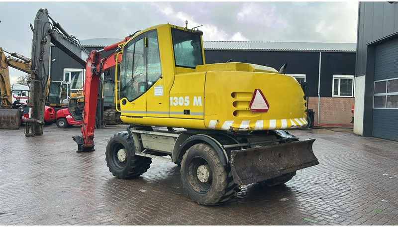 Atlas 1305 - Bager na kotačima: slika Atlas 1305 - Bager na kotačima Atlas 1305 - Bager na kotačima: slika Atlas 1305 - Bager na kotačima