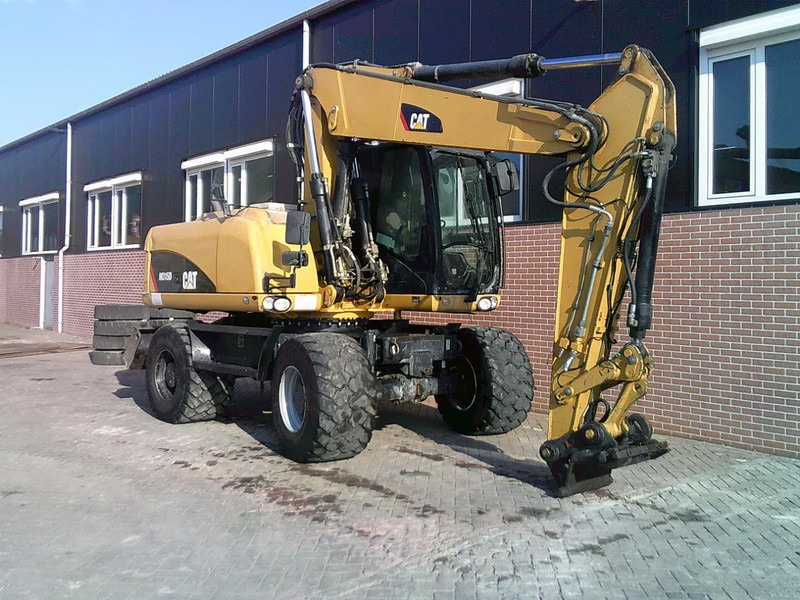 Caterpillar M315D - Bager na kotačima: slika Caterpillar M315D - Bager na kotačima Caterpillar M315D - Bager na kotačima: slika Caterpillar M315D - Bager na kotačima