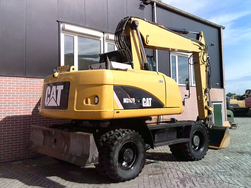 Caterpillar M316D - Bager na kotačima: slika Caterpillar M316D - Bager na kotačima Caterpillar M316D - Bager na kotačima: slika Caterpillar M316D - Bager na kotačima