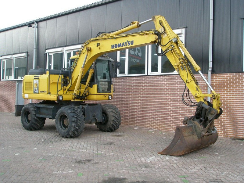 Komatsu PW140-7 - Bager na kotačima: slika Komatsu PW140-7 - Bager na kotačima Komatsu PW140-7 - Bager na kotačima: slika Komatsu PW140-7 - Bager na kotačima