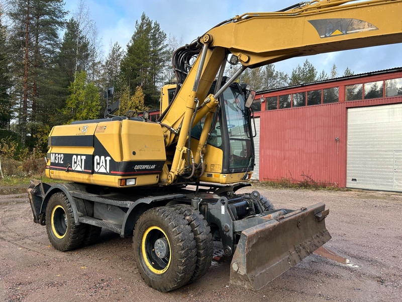 Caterpillar M312 Engcon EC20 tiltrotator - Bager na kotačima: slika Caterpillar M312 Engcon EC20 tiltrotator - Bager na kotačima Caterpillar M312 Engcon EC20 tiltrotator - Bager na kotačima: slika Caterpillar M312 Engcon EC20 tiltrotator - Bager na kotačima