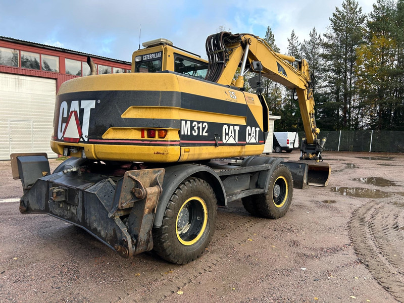 Bager na kotačima Caterpillar M312 Engcon EC20 tiltrotator: slika Bager na kotačima Caterpillar M312 Engcon EC20 tiltrotator Bager na kotačima Caterpillar M312 Engcon EC20 tiltrotator: slika Bager na kotačima Caterpillar M312 Engcon EC20 tiltrotator