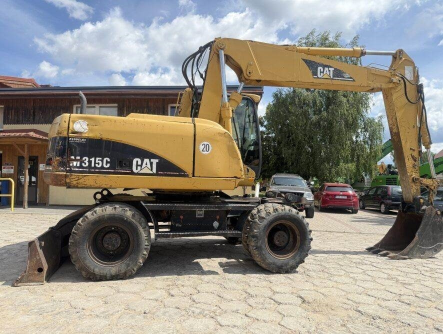 CAT M315C AC - Bager na kotačima: slika CAT M315C AC - Bager na kotačima CAT M315C AC - Bager na kotačima: slika CAT M315C AC - Bager na kotačima