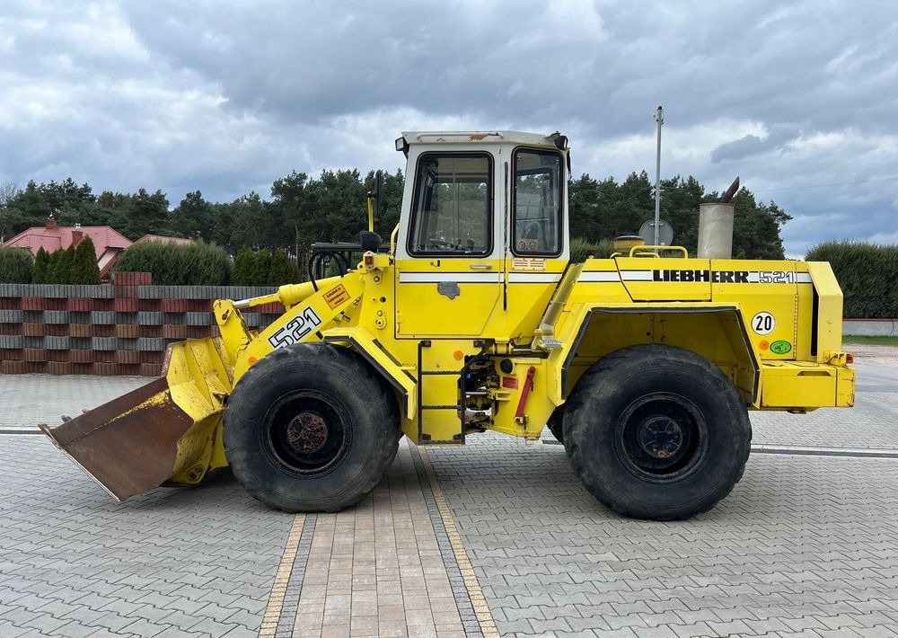Liebherr L 521 - Utovarivač na kotačima: slika Liebherr L 521 - Utovarivač na kotačima Liebherr L 521 - Utovarivač na kotačima: slika Liebherr L 521 - Utovarivač na kotačima