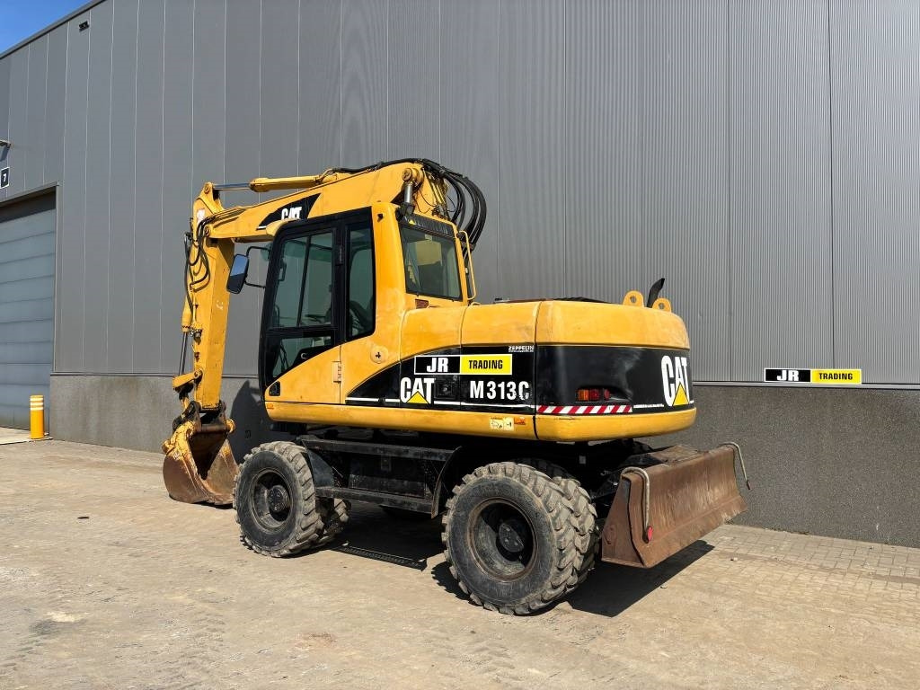 CAT M 313 C (Low verified hours) - Bager na kotačima: slika CAT M 313 C (Low verified hours) - Bager na kotačima CAT M 313 C (Low verified hours) - Bager na kotačima: slika CAT M 313 C (Low verified hours) - Bager na kotačima