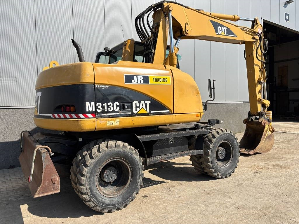 CAT M 313 C (Low verified hours) - Bager na kotačima: slika CAT M 313 C (Low verified hours) - Bager na kotačima CAT M 313 C (Low verified hours) - Bager na kotačima: slika CAT M 313 C (Low verified hours) - Bager na kotačima