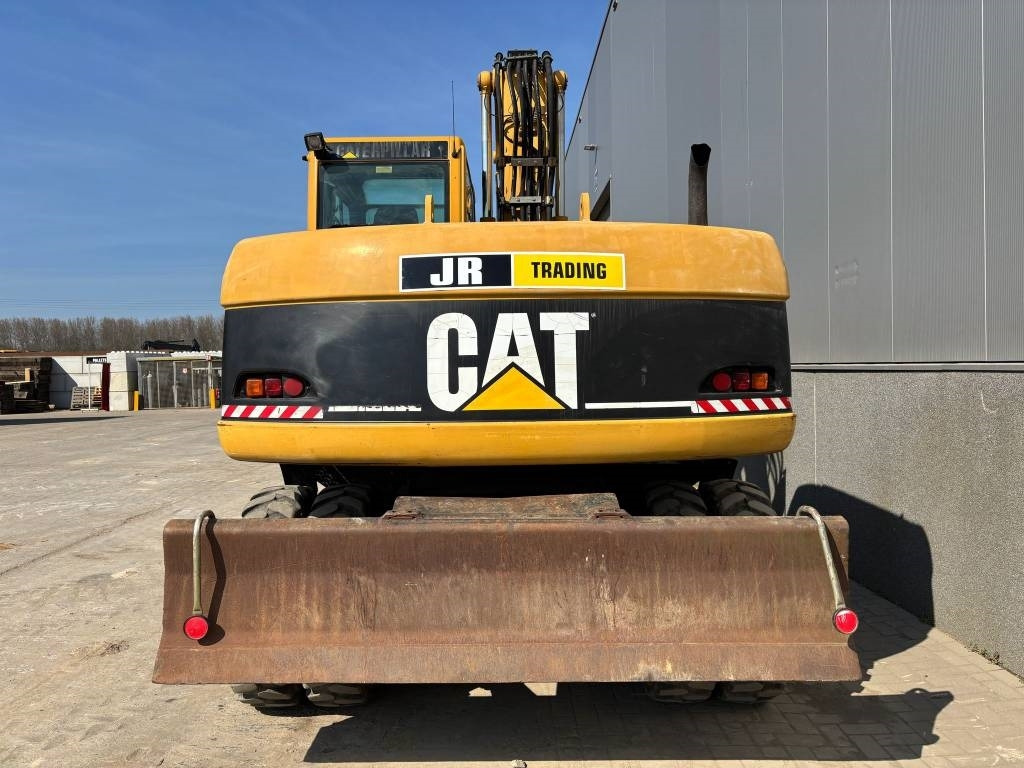 CAT M 313 C (Low verified hours) - Bager na kotačima: slika CAT M 313 C (Low verified hours) - Bager na kotačima CAT M 313 C (Low verified hours) - Bager na kotačima: slika CAT M 313 C (Low verified hours) - Bager na kotačima
