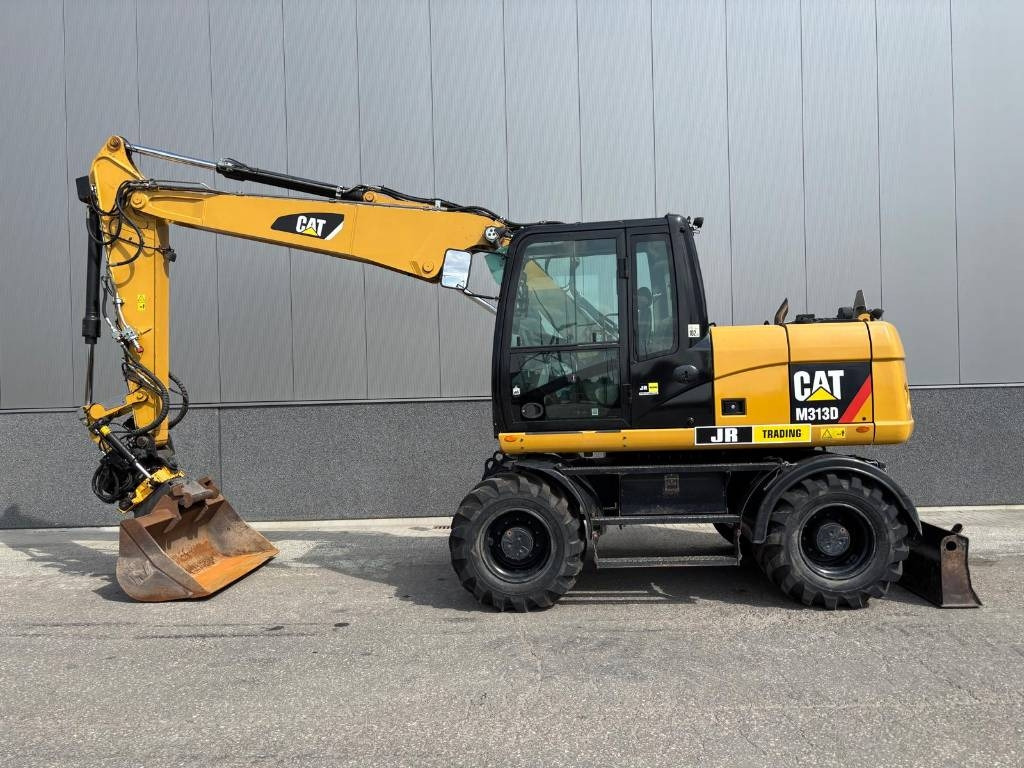 CAT M 313 D - Bager na kotačima: slika CAT M 313 D - Bager na kotačima CAT M 313 D - Bager na kotačima: slika CAT M 313 D - Bager na kotačima