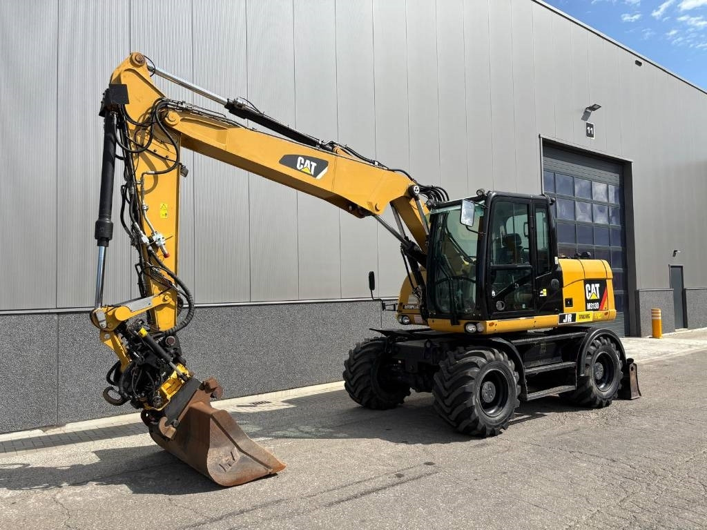 CAT M 313 D - Bager na kotačima: slika CAT M 313 D - Bager na kotačima CAT M 313 D - Bager na kotačima: slika CAT M 313 D - Bager na kotačima