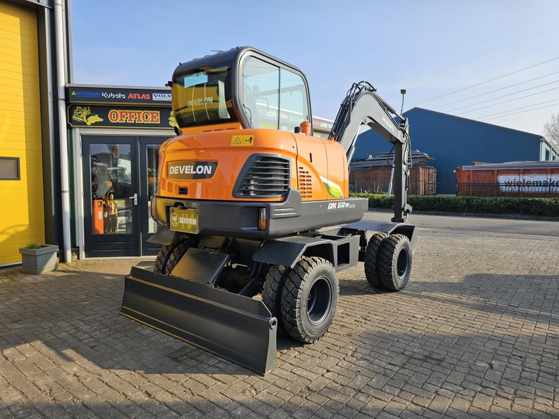 Develon DX60WN ECO-1 - Bager na kotačima: slika Develon DX60WN ECO-1 - Bager na kotačima Develon DX60WN ECO-1 - Bager na kotačima: slika Develon DX60WN ECO-1 - Bager na kotačima