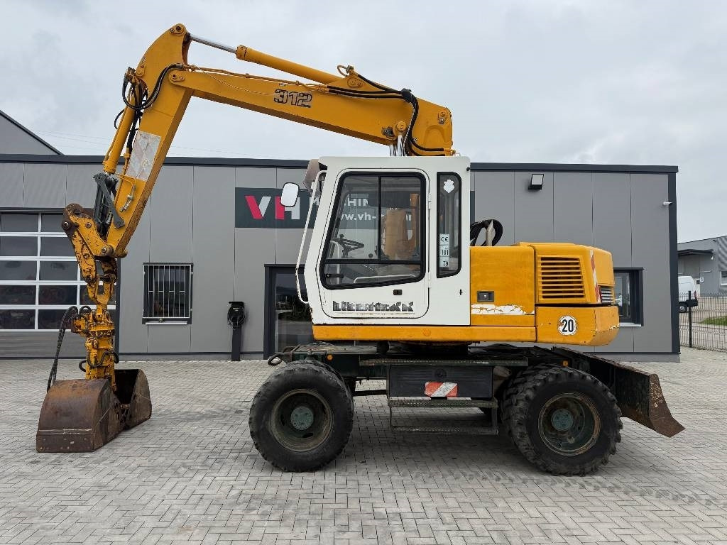 Liebherr A 312 - Bager na kotačima: slika Liebherr A 312 - Bager na kotačima Liebherr A 312 - Bager na kotačima: slika Liebherr A 312 - Bager na kotačima