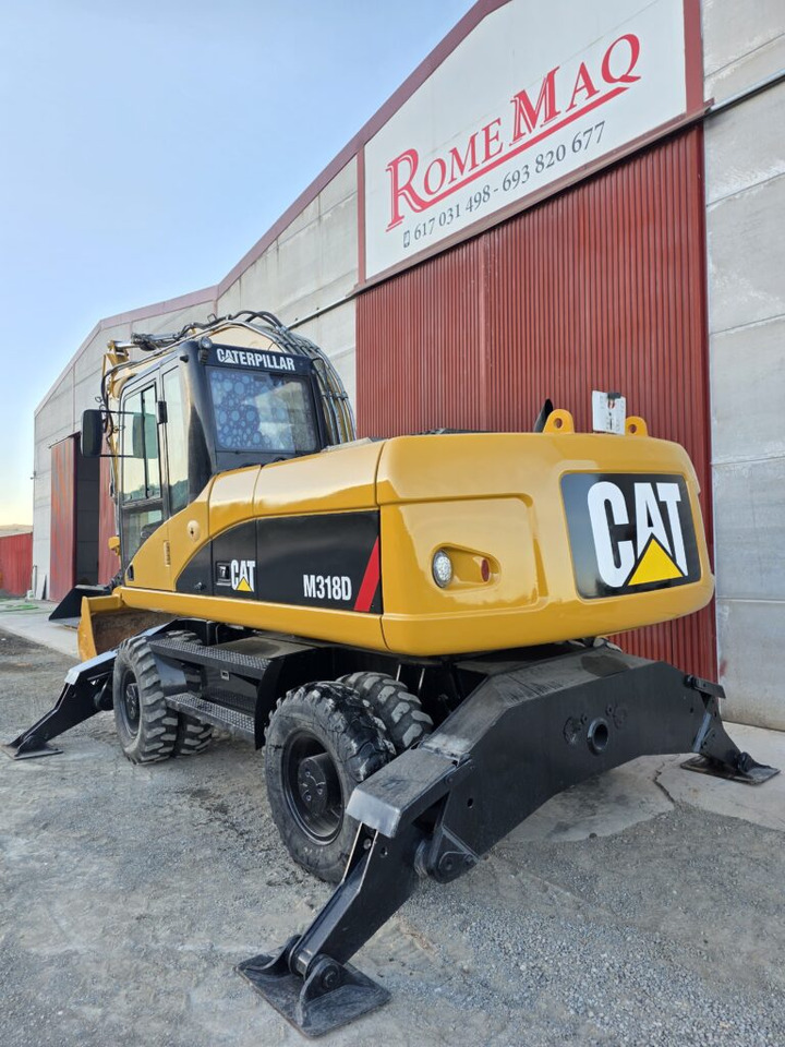 CAT M318D - Bager na kotačima: slika CAT M318D - Bager na kotačima CAT M318D - Bager na kotačima: slika CAT M318D - Bager na kotačima