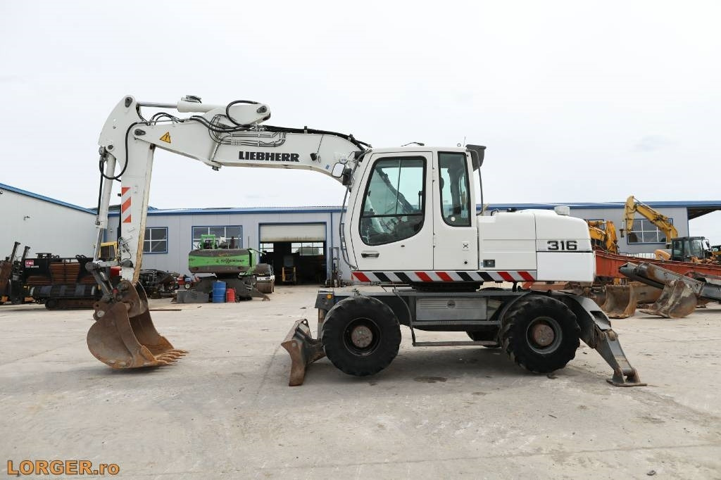 Liebherr A 316 Litronic - Bager na kotačima: slika Liebherr A 316 Litronic - Bager na kotačima Liebherr A 316 Litronic - Bager na kotačima: slika Liebherr A 316 Litronic - Bager na kotačima