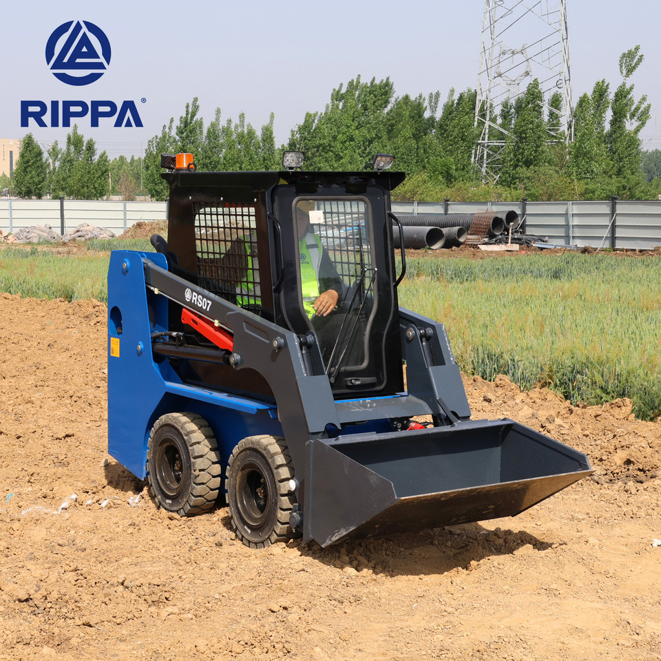 Rippa RS07 Compact Loader | 24.4hp Kubota Power | High Flow Dual Pump | Comfortable A/C Cabin - Mini utovarivač: slika Rippa RS07 Compact Loader | 24.4hp Kubota Power | High Flow Dual Pump | Comfortable A/C Cabin - Mini utovarivač Rippa RS07 Compact Loader | 24.4hp Kubota Power | High Flow Dual Pump | Comfortable A/C Cabin - Mini utovarivač: slika Rippa RS07 Compact Loader | 24.4hp Kubota Power | High Flow Dual Pump | Comfortable A/C Cabin - Mini utovarivač
