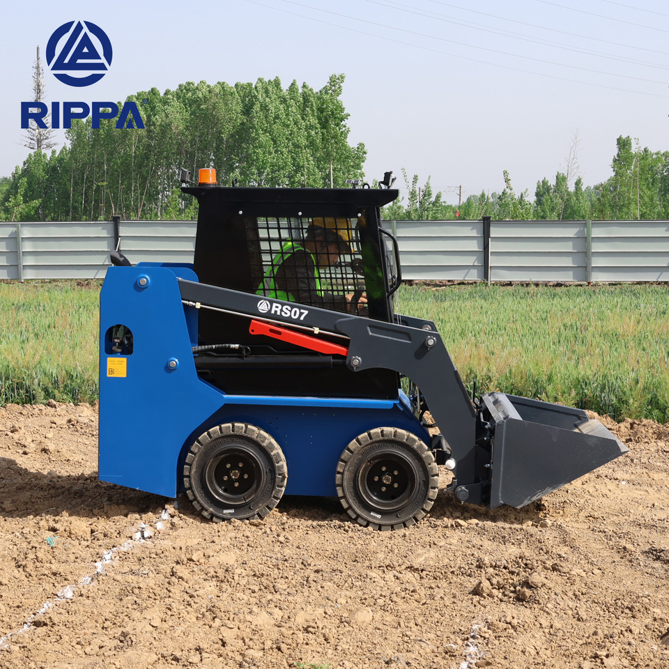 Rippa RS07 Compact Loader | 24.4hp Kubota Power | High Flow Dual Pump | Comfortable A/C Cabin - Mini utovarivač: slika Rippa RS07 Compact Loader | 24.4hp Kubota Power | High Flow Dual Pump | Comfortable A/C Cabin - Mini utovarivač Rippa RS07 Compact Loader | 24.4hp Kubota Power | High Flow Dual Pump | Comfortable A/C Cabin - Mini utovarivač: slika Rippa RS07 Compact Loader | 24.4hp Kubota Power | High Flow Dual Pump | Comfortable A/C Cabin - Mini utovarivač