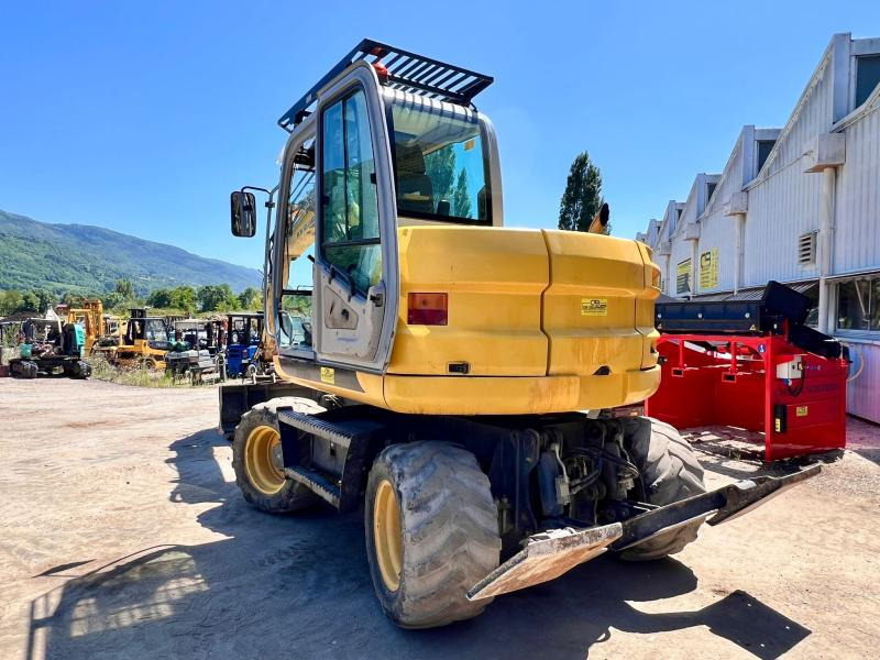 New Holland MH 2.6 PELLE A PNEUS 10T - Bager na kotačima: slika New Holland MH 2.6 PELLE A PNEUS 10T - Bager na kotačima New Holland MH 2.6 PELLE A PNEUS 10T - Bager na kotačima: slika New Holland MH 2.6 PELLE A PNEUS 10T - Bager na kotačima