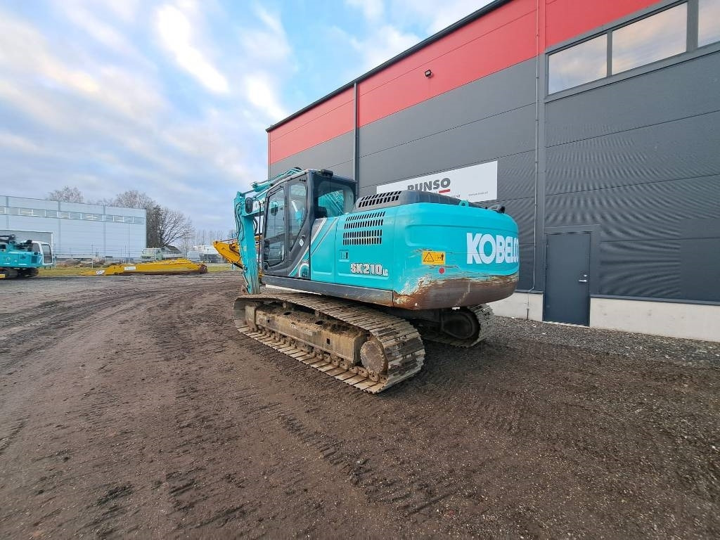 Kobelco SK 210 LC-10 - Bager gusjeničar: slika Kobelco SK 210 LC-10 - Bager gusjeničar Kobelco SK 210 LC-10 - Bager gusjeničar: slika Kobelco SK 210 LC-10 - Bager gusjeničar