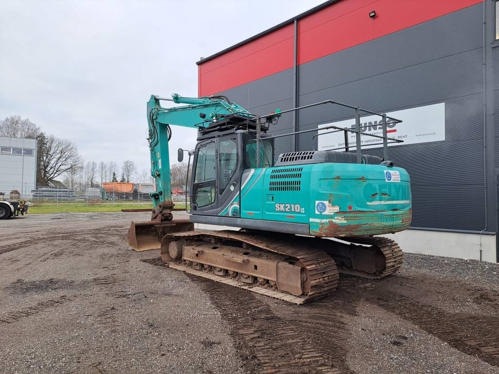 Kobelco SK 210 LC-10 - Bager gusjeničar: slika Kobelco SK 210 LC-10 - Bager gusjeničar Kobelco SK 210 LC-10 - Bager gusjeničar: slika Kobelco SK 210 LC-10 - Bager gusjeničar