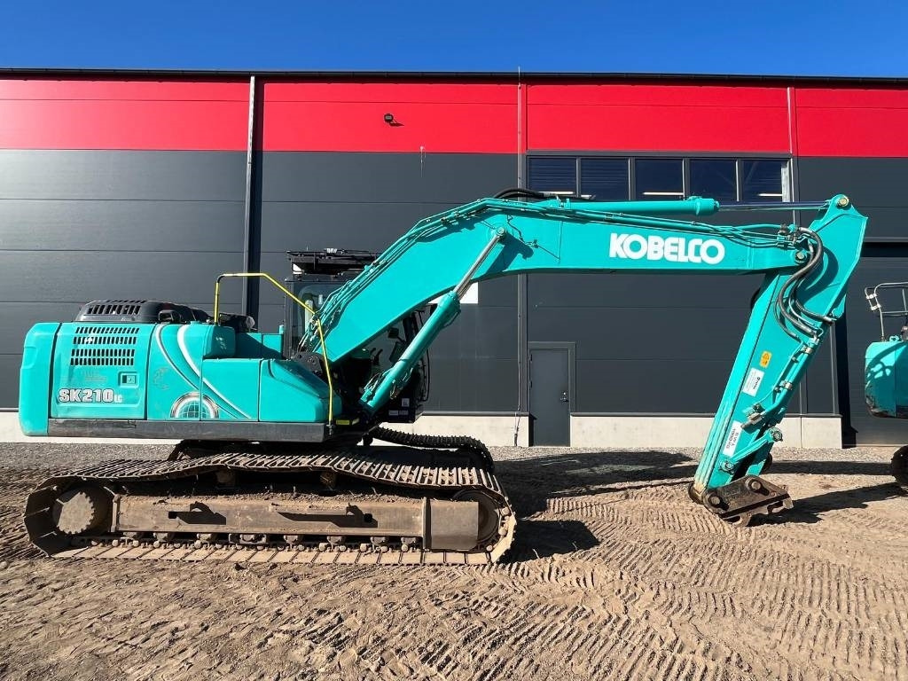 Kobelco SK 210 LC-10E - Bager gusjeničar: slika Kobelco SK 210 LC-10E - Bager gusjeničar Kobelco SK 210 LC-10E - Bager gusjeničar: slika Kobelco SK 210 LC-10E - Bager gusjeničar