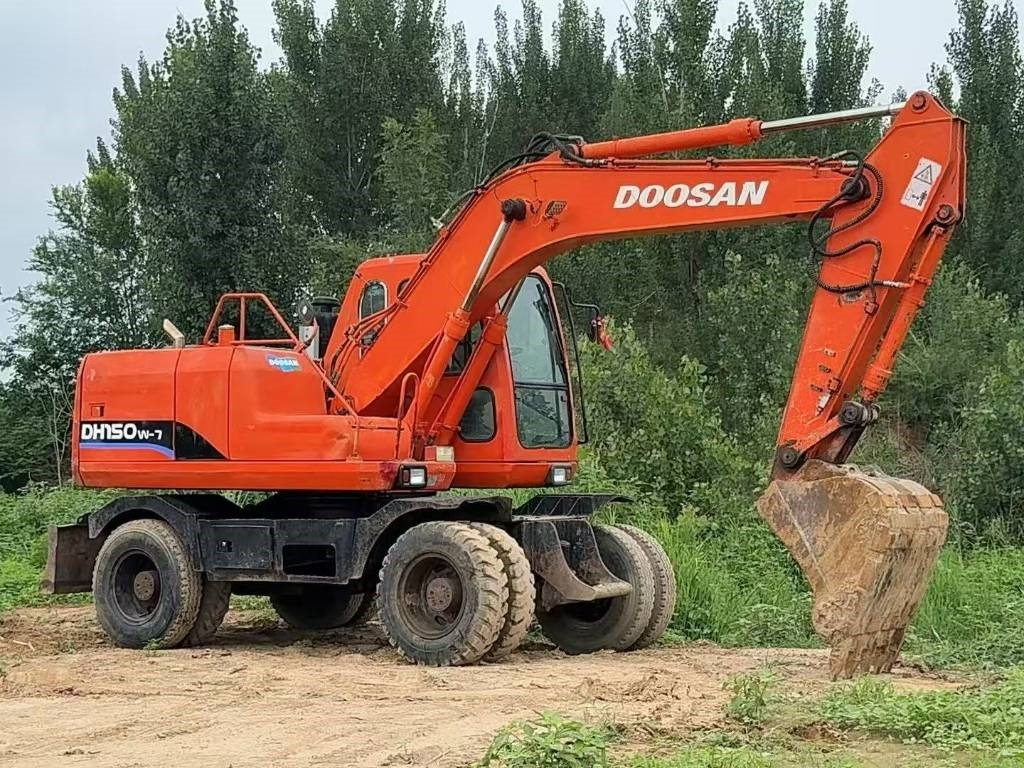 Doosan DH 150 W-7 - Bager na kotačima: slika Doosan DH 150 W-7 - Bager na kotačima Doosan DH 150 W-7 - Bager na kotačima: slika Doosan DH 150 W-7 - Bager na kotačima