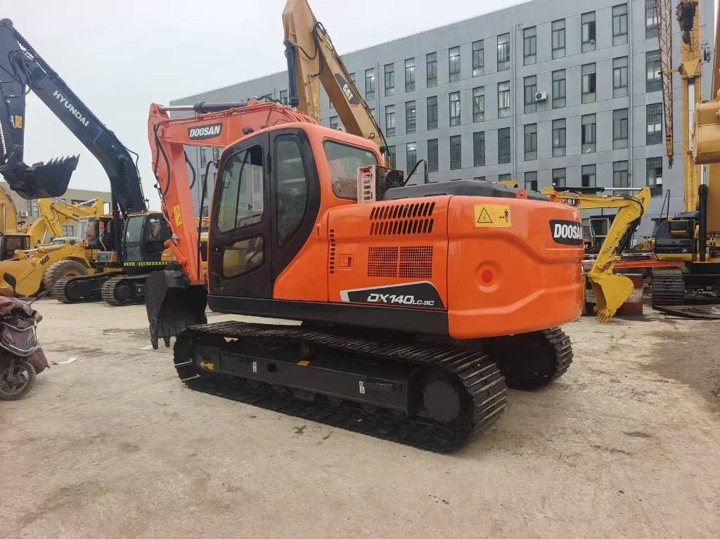 Doosan DX 140 - Bager gusjeničar: slika Doosan DX 140 - Bager gusjeničar Doosan DX 140 - Bager gusjeničar: slika Doosan DX 140 - Bager gusjeničar