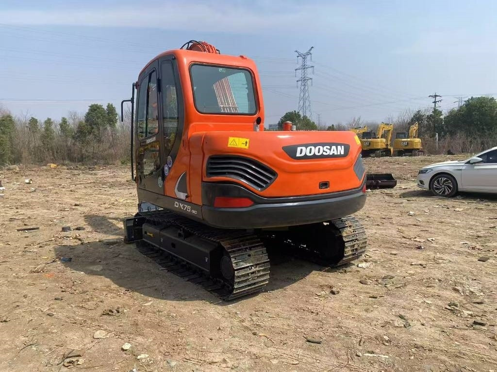 Doosan DX 75-9 C - Mini bager: slika Doosan DX 75-9 C - Mini bager Doosan DX 75-9 C - Mini bager: slika Doosan DX 75-9 C - Mini bager