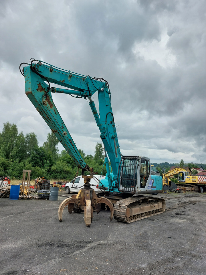 KOBELCO SK220 - Stroj za rukovanje otpadom: slika KOBELCO SK220 - Stroj za rukovanje otpadom KOBELCO SK220 - Stroj za rukovanje otpadom: slika KOBELCO SK220 - Stroj za rukovanje otpadom