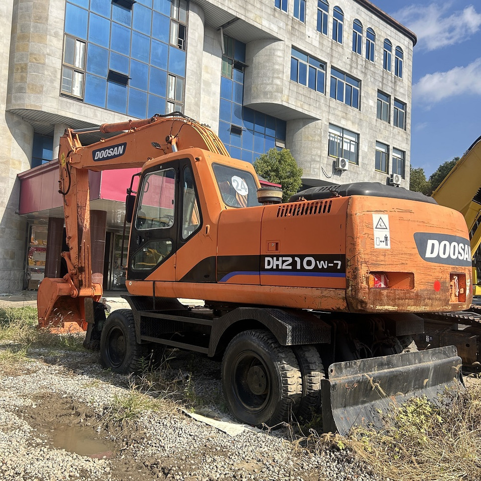 Doosan DH210w-7 wheel excavator - Bager na kotačima: slika Doosan DH210w-7 wheel excavator - Bager na kotačima Doosan DH210w-7 wheel excavator - Bager na kotačima: slika Doosan DH210w-7 wheel excavator - Bager na kotačima
