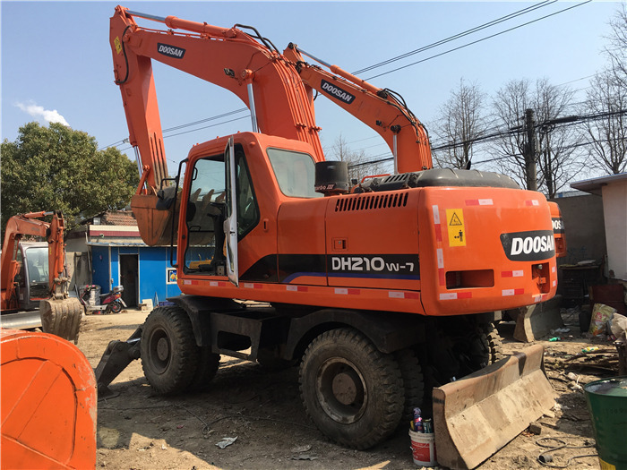 Doosan DH210w-7 wheel excavator - Bager na kotačima: slika Doosan DH210w-7 wheel excavator - Bager na kotačima Doosan DH210w-7 wheel excavator - Bager na kotačima: slika Doosan DH210w-7 wheel excavator - Bager na kotačima