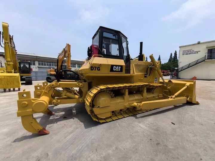 Second Hand Original Caterpillar Bulldozer D7 Used CAT D7G Dozer on Hot Sale in China - Buldožer: slika Second Hand Original Caterpillar Bulldozer D7 Used CAT D7G Dozer on Hot Sale in China - Buldožer Second Hand Original Caterpillar Bulldozer D7 Used CAT D7G Dozer on Hot Sale in China - Buldožer: slika Second Hand Original Caterpillar Bulldozer D7 Used CAT D7G Dozer on Hot Sale in China - Buldožer