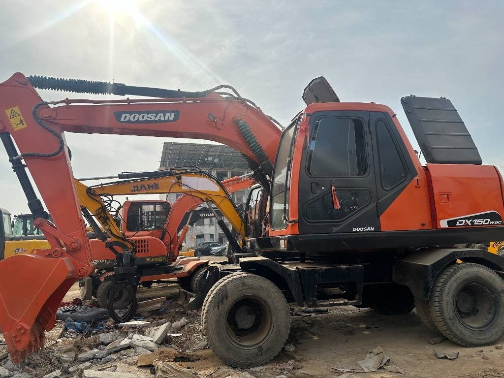Doosan DH 150 W-7 - Bager na kotačima: slika Doosan DH 150 W-7 - Bager na kotačima Doosan DH 150 W-7 - Bager na kotačima: slika Doosan DH 150 W-7 - Bager na kotačima