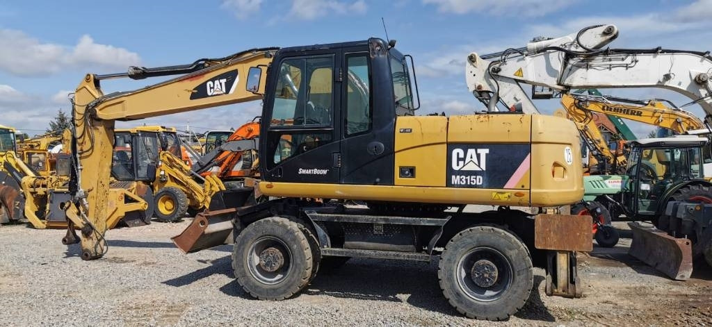 CAT M 315 D - Bager na kotačima: slika CAT M 315 D - Bager na kotačima CAT M 315 D - Bager na kotačima: slika CAT M 315 D - Bager na kotačima