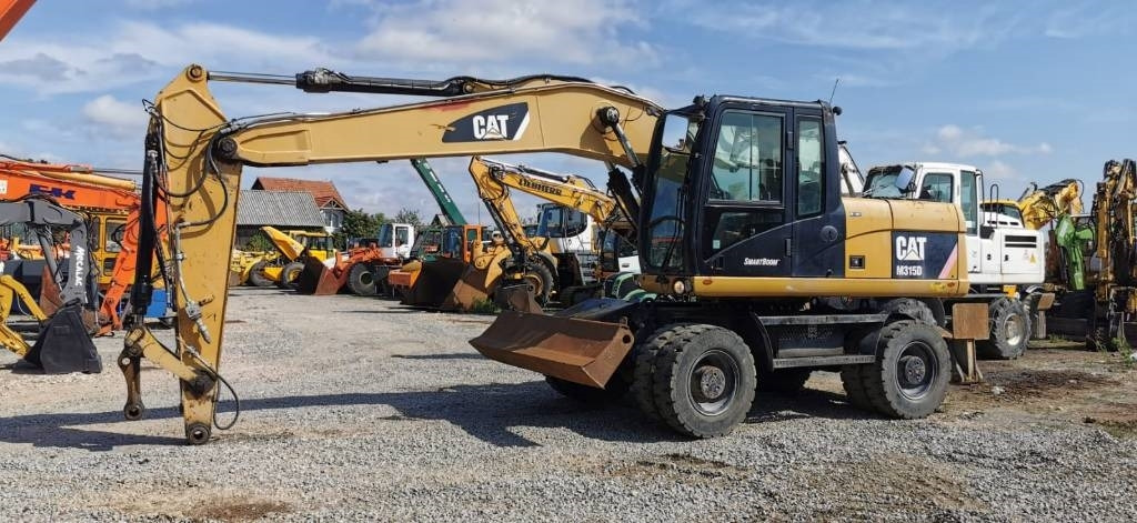 CAT M 315 D - Bager na kotačima: slika CAT M 315 D - Bager na kotačima CAT M 315 D - Bager na kotačima: slika CAT M 315 D - Bager na kotačima