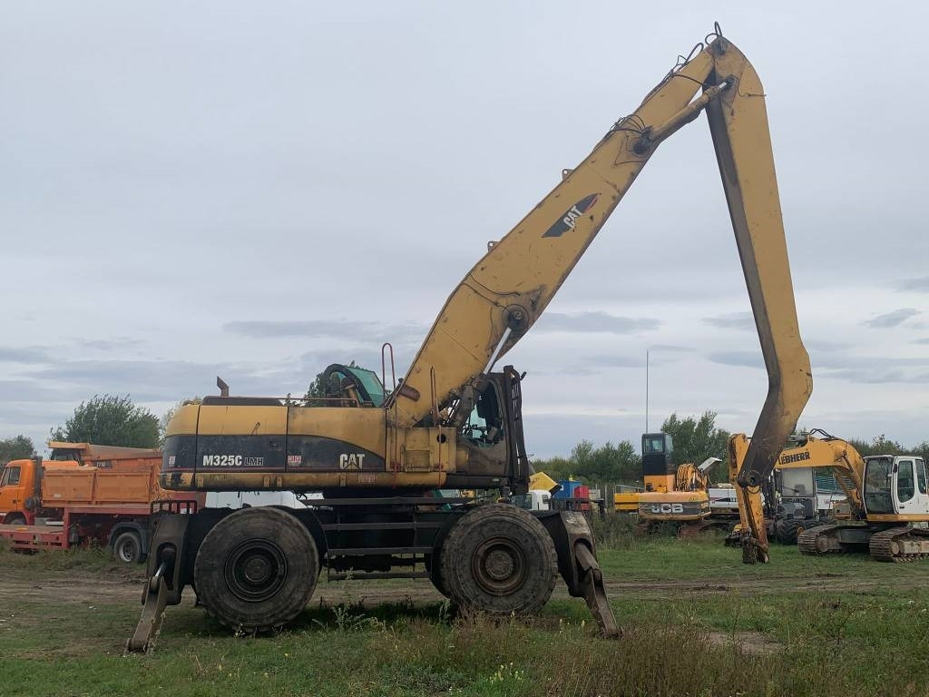 CAT M 325 C L MH - Stroj za rukovanje otpadom: slika CAT M 325 C L MH - Stroj za rukovanje otpadom CAT M 325 C L MH - Stroj za rukovanje otpadom: slika CAT M 325 C L MH - Stroj za rukovanje otpadom