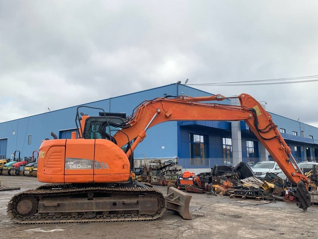Doosan DX 140 LCR - Bager gusjeničar: slika Doosan DX 140 LCR - Bager gusjeničar Doosan DX 140 LCR - Bager gusjeničar: slika Doosan DX 140 LCR - Bager gusjeničar