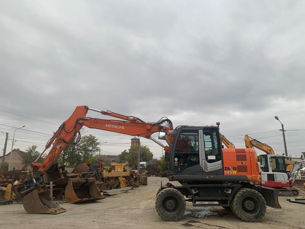 Hitachi ZX 145 W-3+SMP Rototilt - Bager na kotačima: slika Hitachi ZX 145 W-3+SMP Rototilt - Bager na kotačima Hitachi ZX 145 W-3+SMP Rototilt - Bager na kotačima: slika Hitachi ZX 145 W-3+SMP Rototilt - Bager na kotačima