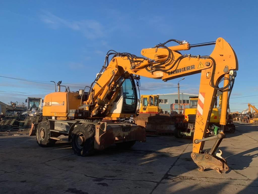 Liebherr A 314 Litronic - Bager na kotačima: slika Liebherr A 314 Litronic - Bager na kotačima Liebherr A 314 Litronic - Bager na kotačima: slika Liebherr A 314 Litronic - Bager na kotačima