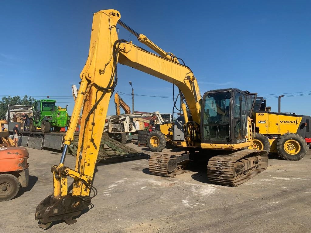 New Holland E 135 SR - Bager gusjeničar: slika New Holland E 135 SR - Bager gusjeničar New Holland E 135 SR - Bager gusjeničar: slika New Holland E 135 SR - Bager gusjeničar