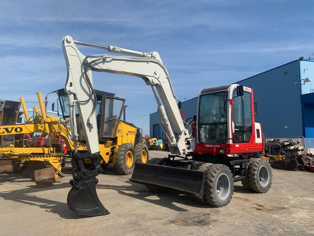 Takeuchi TB070W - Bager na kotačima: slika Takeuchi TB070W - Bager na kotačima Takeuchi TB070W - Bager na kotačima: slika Takeuchi TB070W - Bager na kotačima