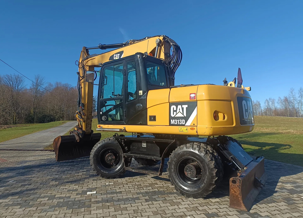 CATERPILLAR M313D - Bager na kotačima: slika CATERPILLAR M313D - Bager na kotačima CATERPILLAR M313D - Bager na kotačima: slika CATERPILLAR M313D - Bager na kotačima