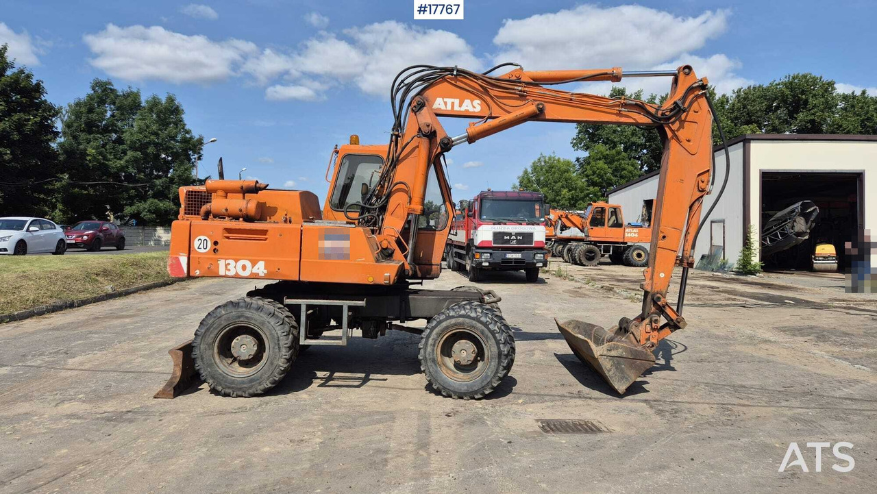 ATLAS 1304 wheeled excavator (1993) - Bager na kotačima: slika ATLAS 1304 wheeled excavator (1993) - Bager na kotačima ATLAS 1304 wheeled excavator (1993) - Bager na kotačima: slika ATLAS 1304 wheeled excavator (1993) - Bager na kotačima