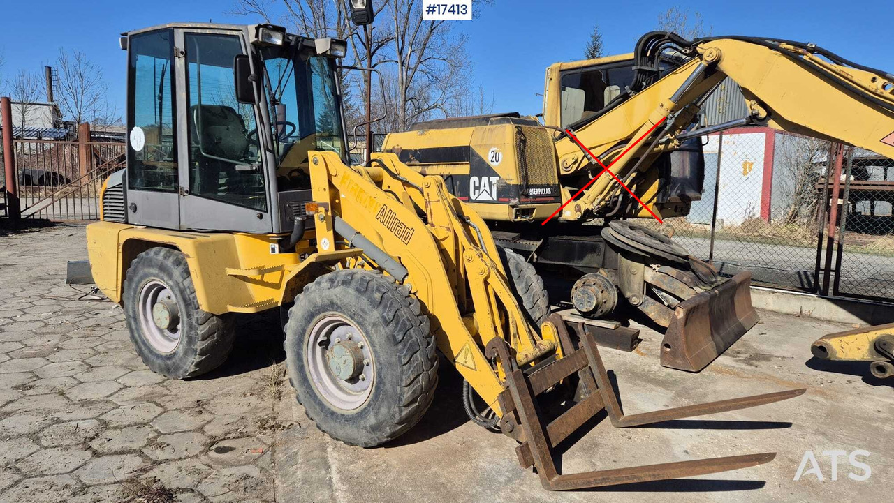 Wheel loader AHLMANN AL 85t 2004) forks, quick coupler, opening bucket. - Utovarivač na kotačima: slika Wheel loader AHLMANN AL 85t 2004) forks, quick coupler, opening bucket. - Utovarivač na kotačima Wheel loader AHLMANN AL 85t 2004) forks, quick coupler, opening bucket. - Utovarivač na kotačima: slika Wheel loader AHLMANN AL 85t 2004) forks, quick coupler, opening bucket. - Utovarivač na kotačima