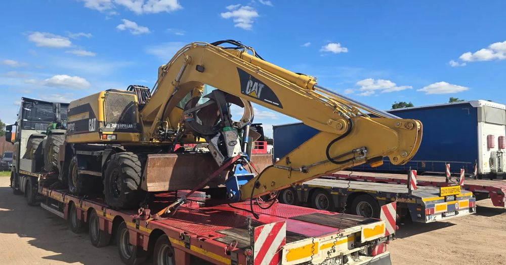 Caterpillar M312 - Bager na kotačima: slika Caterpillar M312 - Bager na kotačima Caterpillar M312 - Bager na kotačima: slika Caterpillar M312 - Bager na kotačima